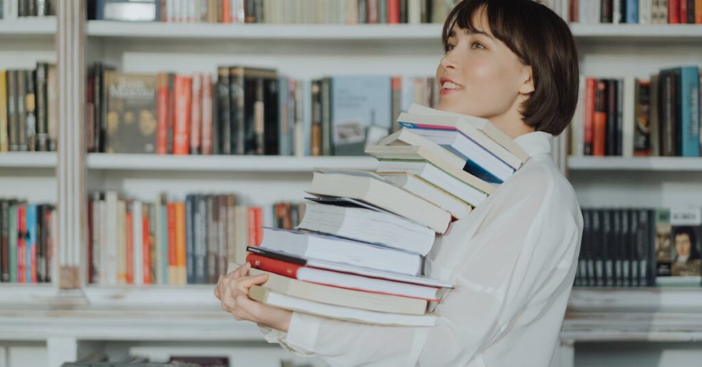 A woman joyfully holds a pile of books in a library, embodying the love of reading and learning.